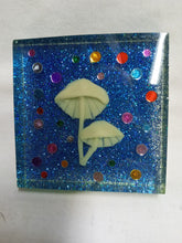 Load image into Gallery viewer, Glow in the Dark Mushrooms Againt Blue Glitter Background Shelf Sitter

