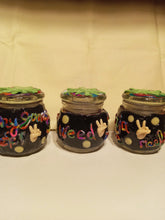 Load image into Gallery viewer, Black Decorative Jar with Weed Leaf Adorned Lid
